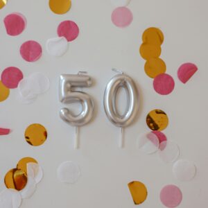 Number 50 candle with confetti